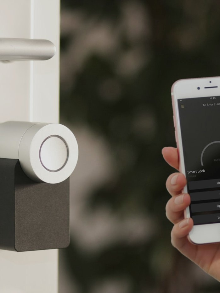 Smartphone controlling a smart lock on a front door