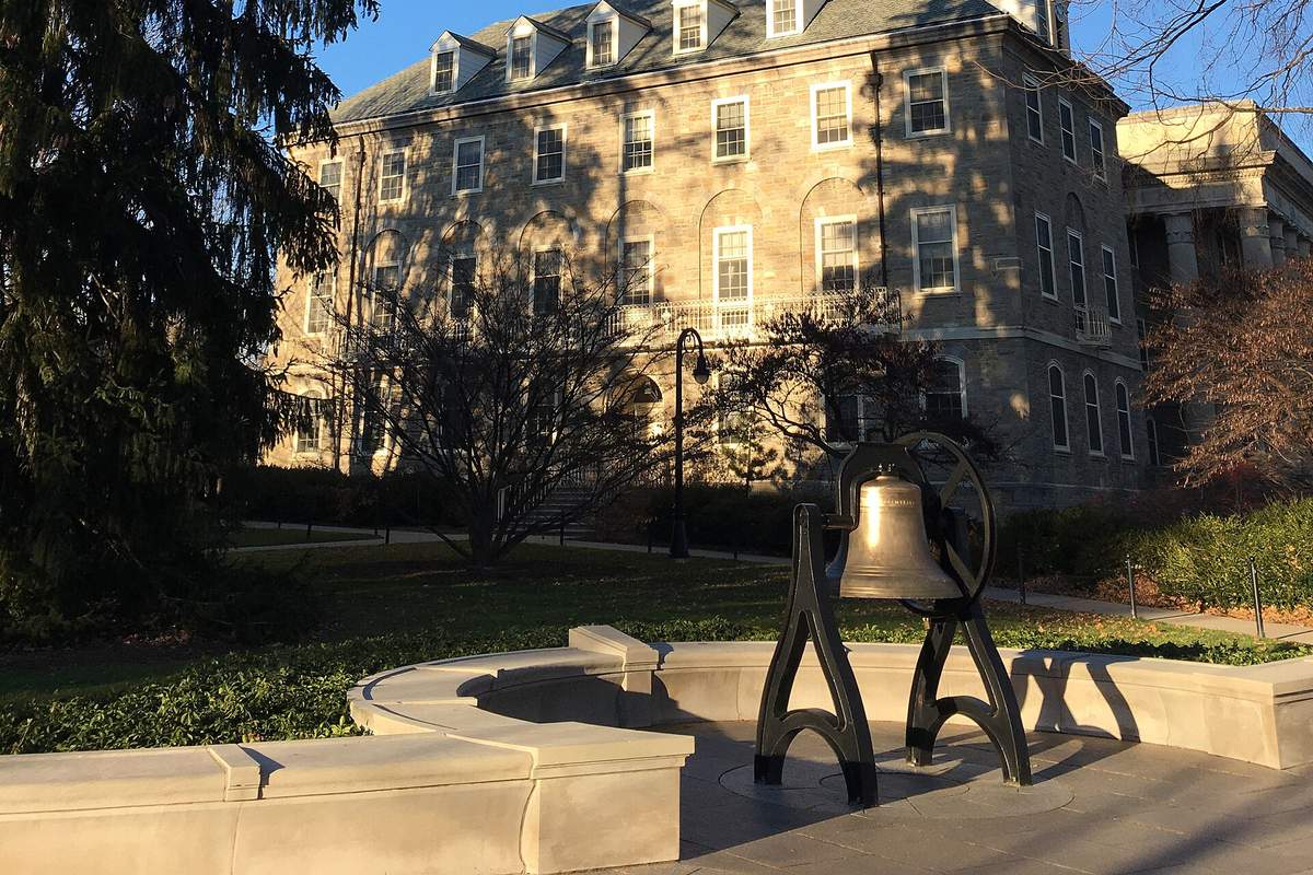 Old Main and historic bell at Penn State in State College, PA