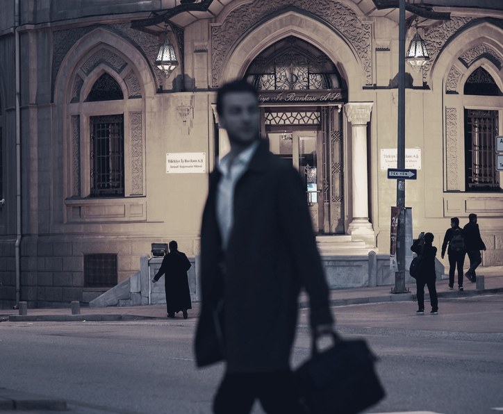 Investigator in a suit walking at night